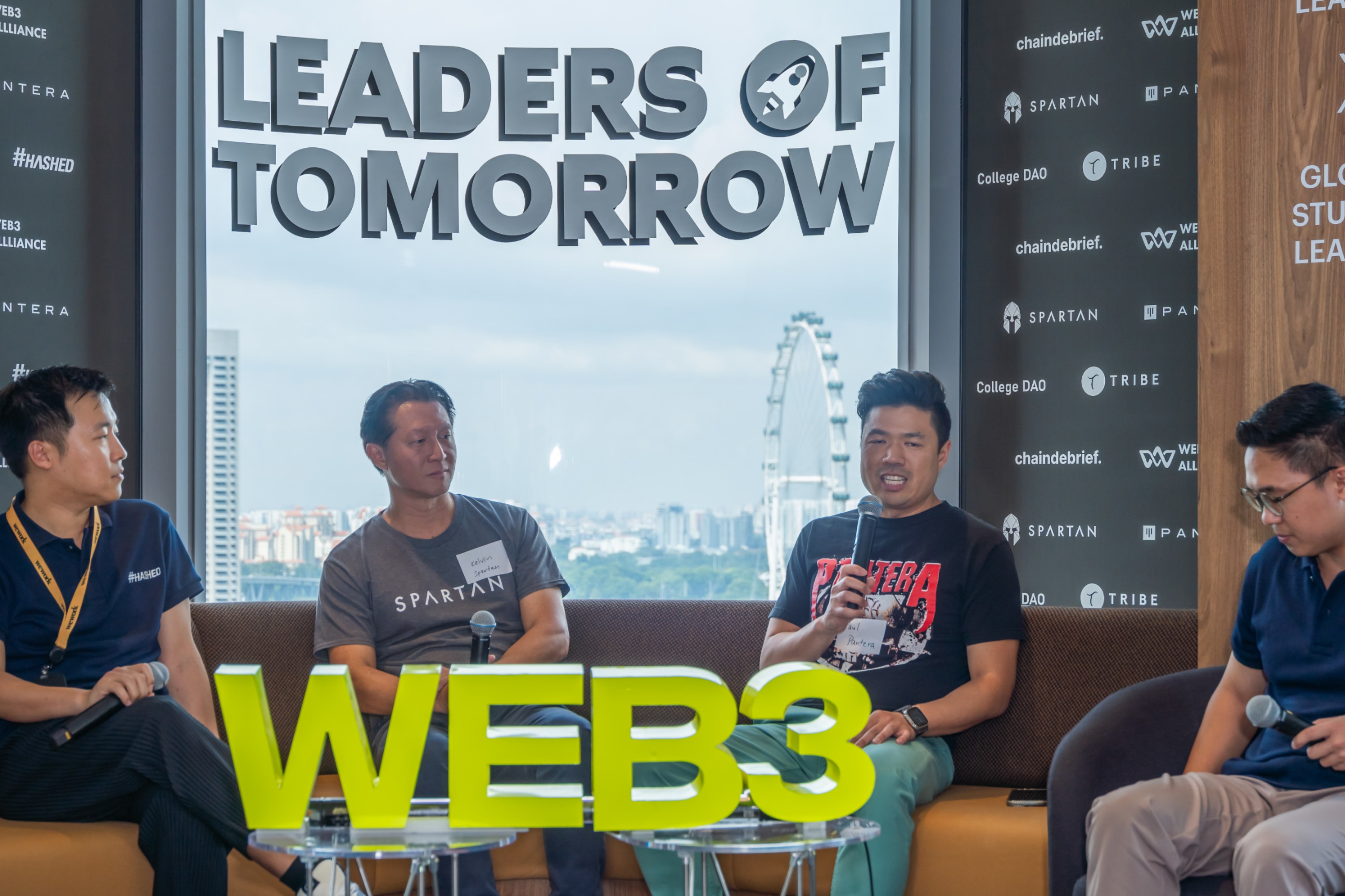 Speakers seated onstage at a Web3 Alliance programme in Singapore.